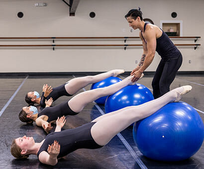 Progressive Ballet Technique (PBT), Lasley Centre for the Performing Arts, Teacher teaching students form by using exercise balls