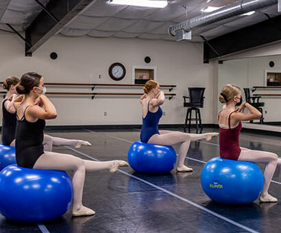 Progressive Ballet Technique (PBT), Lasley Centre for the Performing Arts, Students learning balance and proper foot and toe movements while on exercise balls